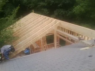 Framing a new roof addition that ties into an existing shingle roof in Battle Ground